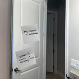 Transparent sticky notes with affirmations displaying on bathroom mirror