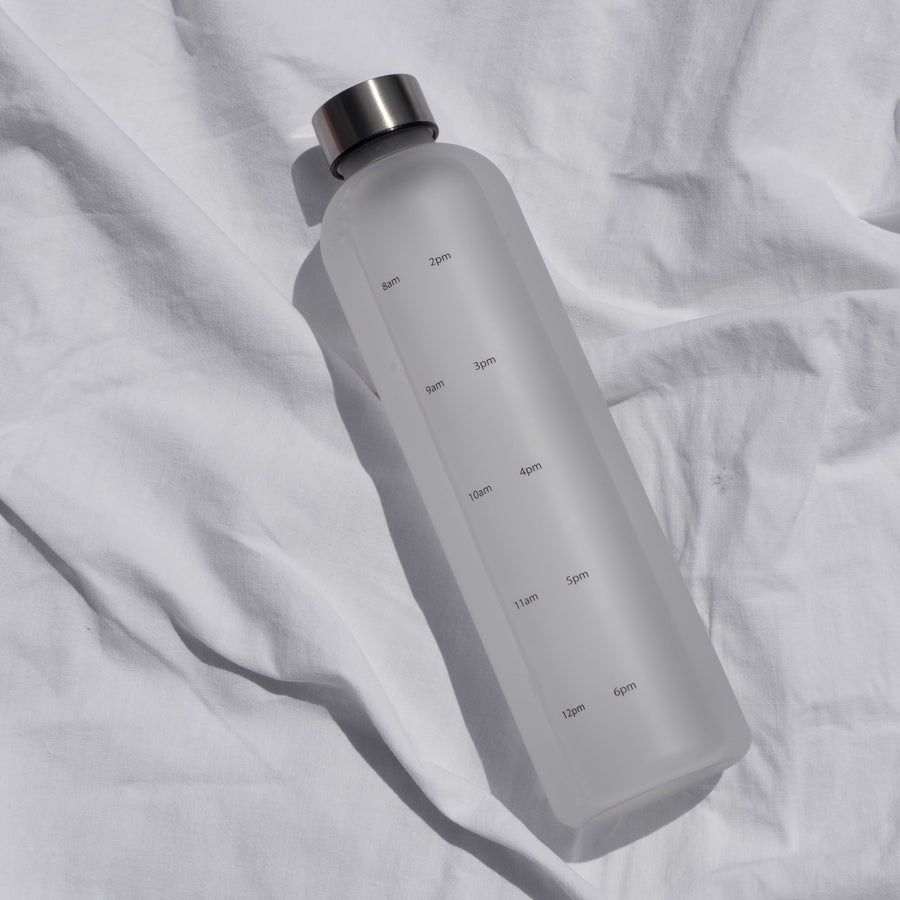 Water tracking bottle on white sheet