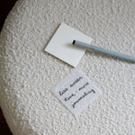 Transparent sticky notes on chair: Less screen time - more journaling